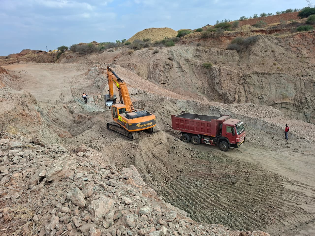 Excavator loading a haul truck